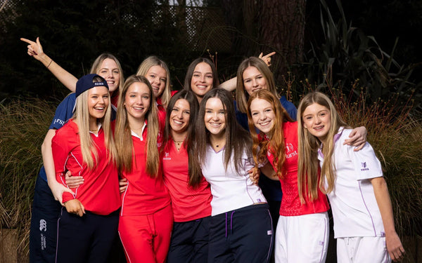Honor Black with the Hurstpierpoint College girls' cricket team, wearing Maiden Cricket kit designed for women and girls.