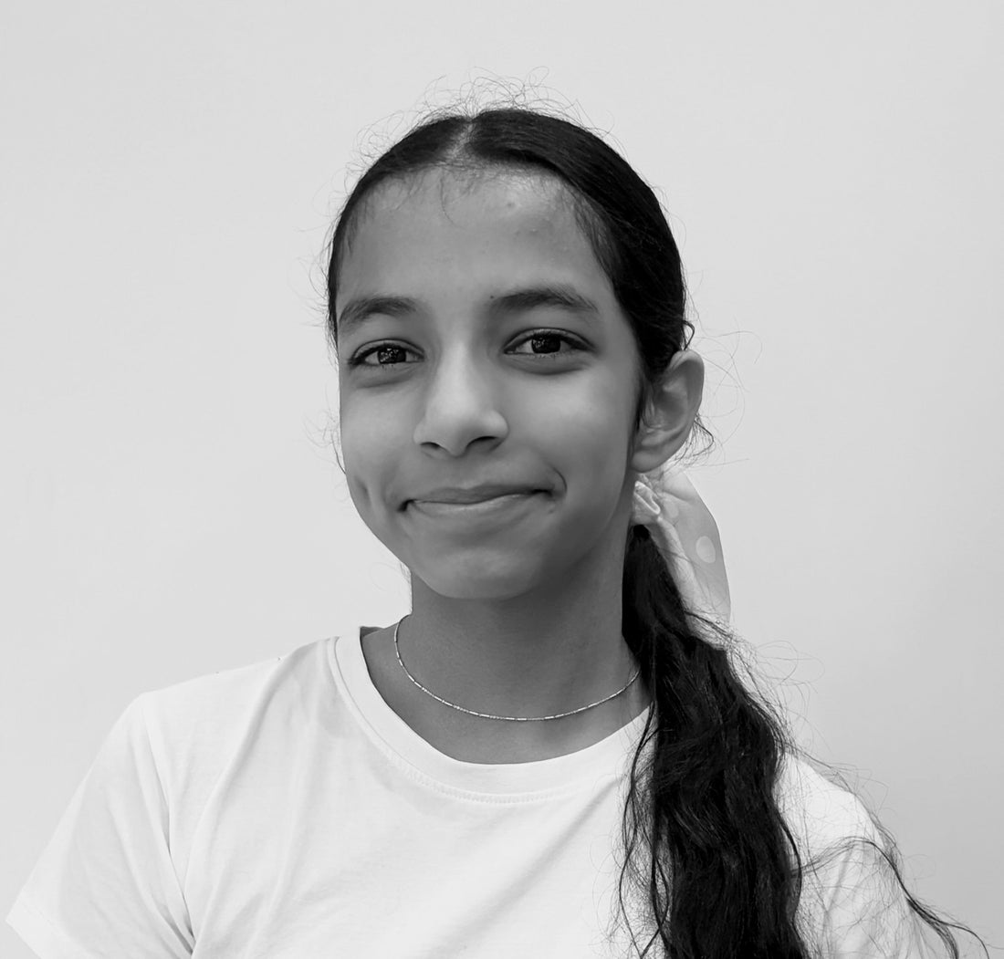 Suhana, a young female cricketer, showcasing her skills on the field.