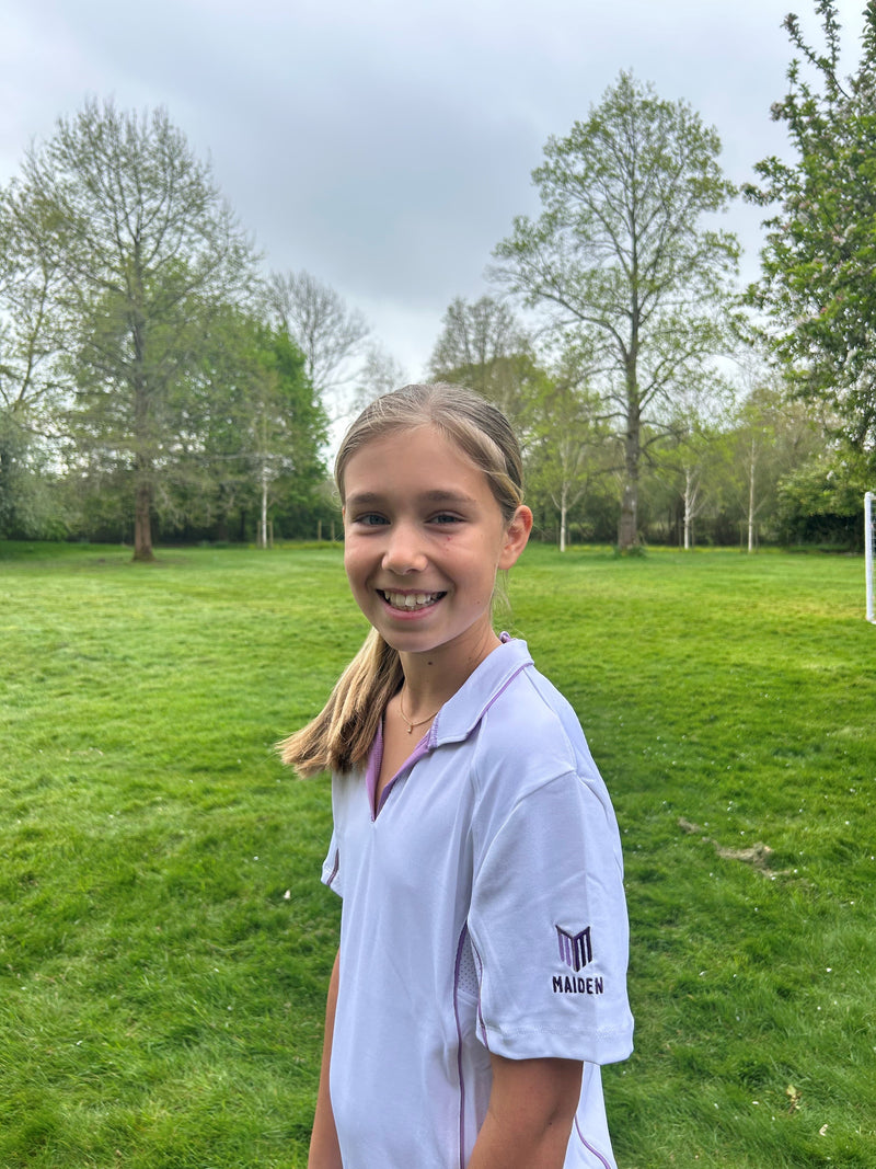 Girl posing in women's cricket kit from Maiden Cricket