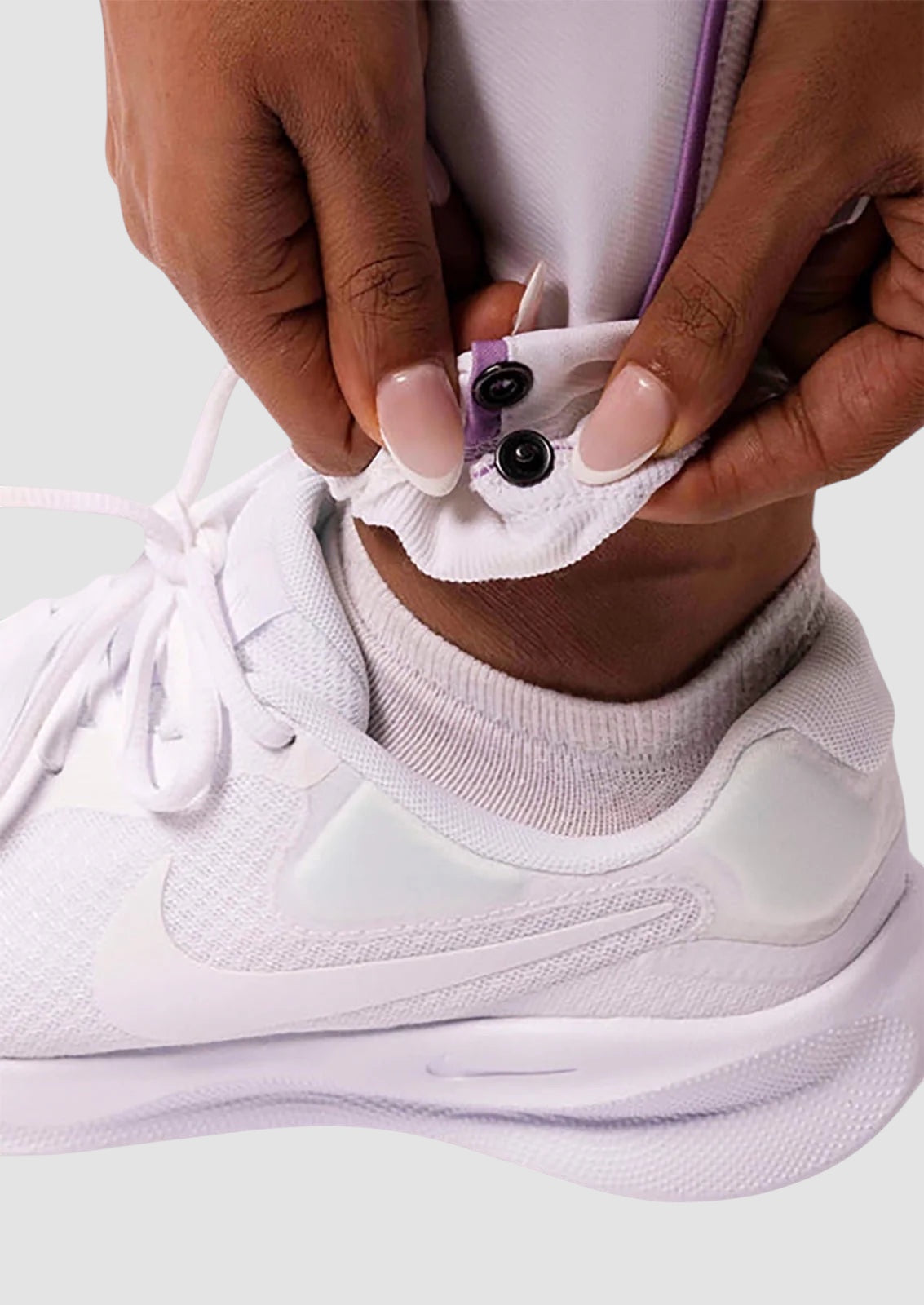 Maiden Cricket women's white cricket trousers featuring adjustable internal poppers at the hem for custom length.