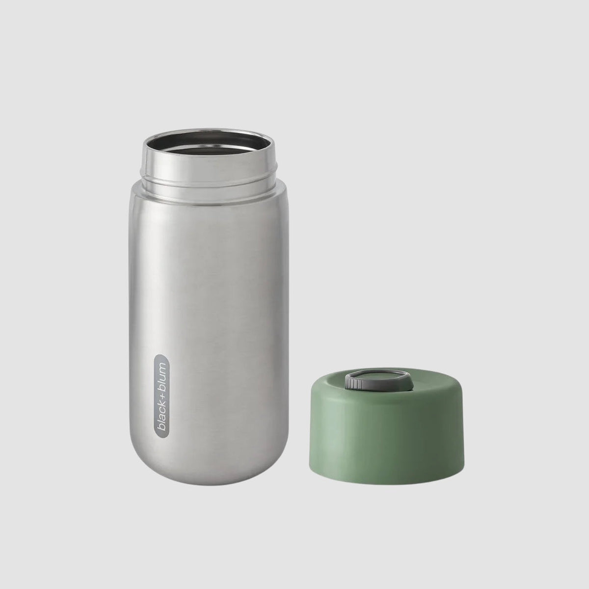 Maiden Cricket Black+Blum stainless steel travel mug with a sage green leak-proof lid, 340ml capacity