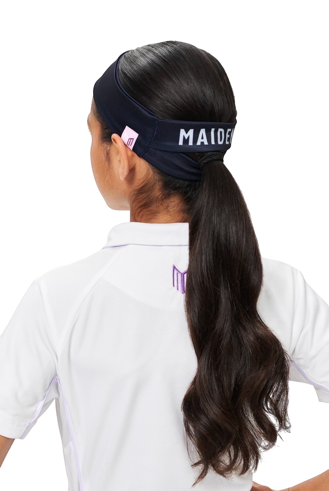 Maiden Cricket Bouncer Headband in black with ponytail opening, worn by a female cricketer from the back view.