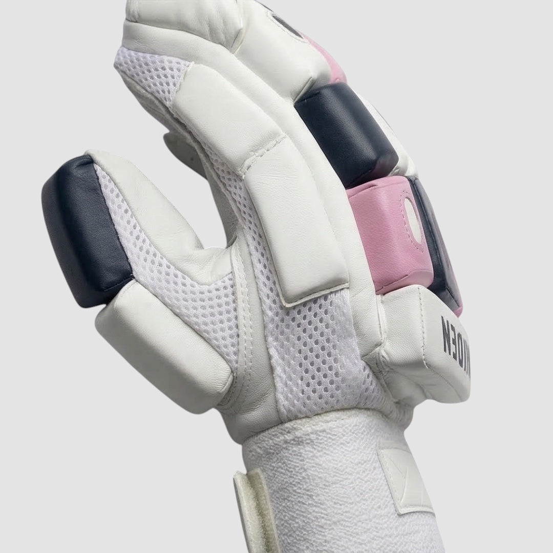 Maiden Cricket girls batting gloves with white sheepskin palm, pink and navy foam padding, and mesh airflow zones.