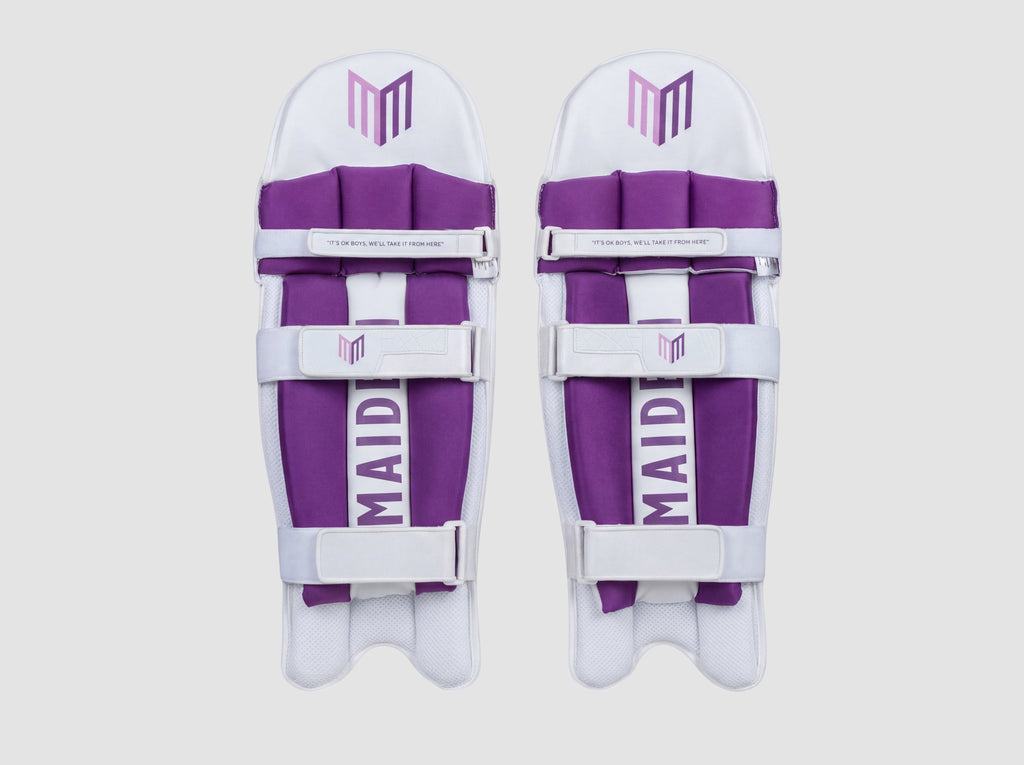 Maiden Cricket girls' white and purple batting pads with ergonomic knee curve and soft-touch support straps.
