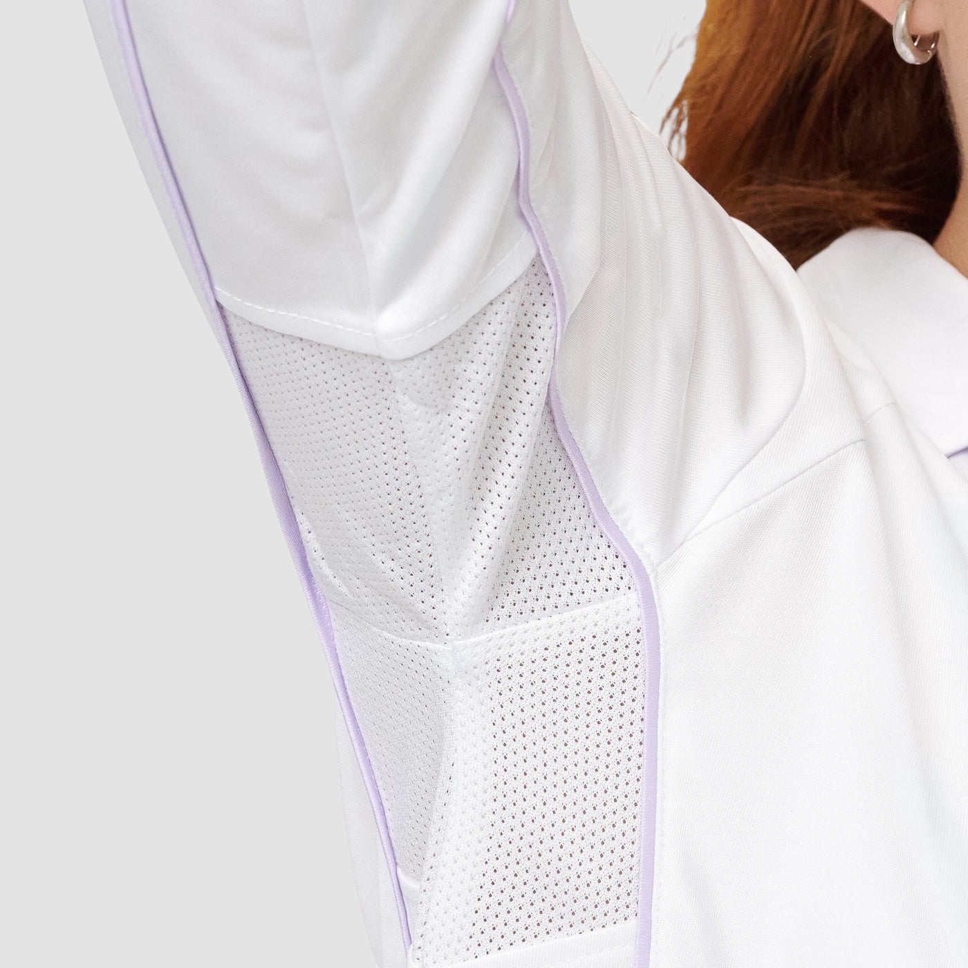 Maiden Cricket girls long sleeve cricket top in white with breathable mesh underarm panels and light purple piping