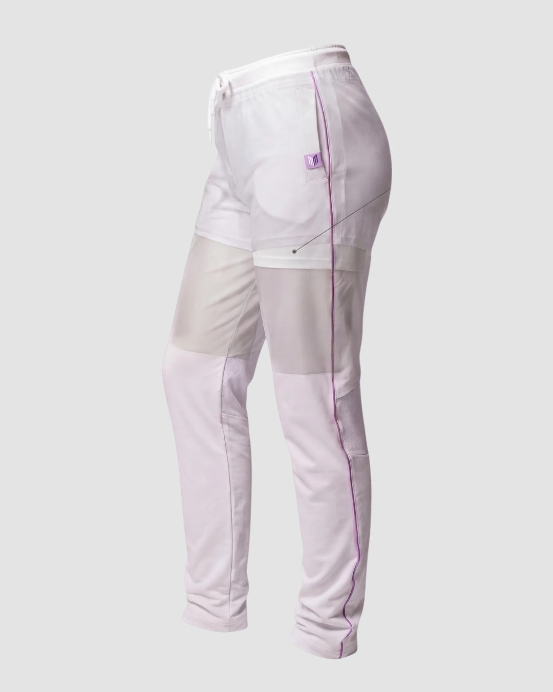 Maiden Cricket girls' white cricket trousers with purple piping, built-in shorts, and mesh knee vents for airflow.