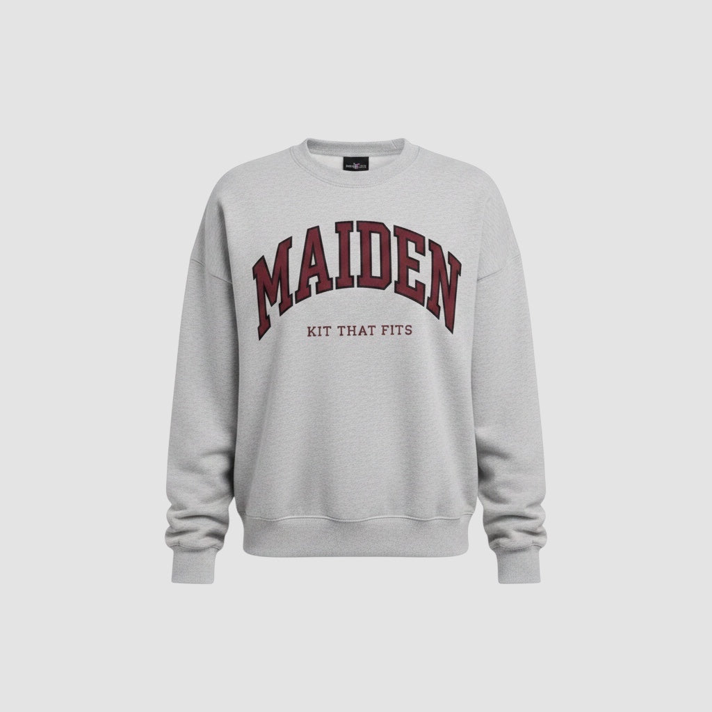 Maiden Cricket heather grey crewneck sweatshirt with maroon and black collegiate graphic text on the chest.