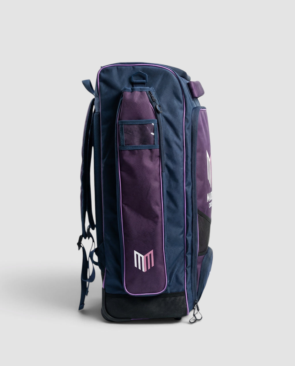 Maiden Cricket kit bag in navy and purple with ergonomic straps and wheels, designed for women and girls.