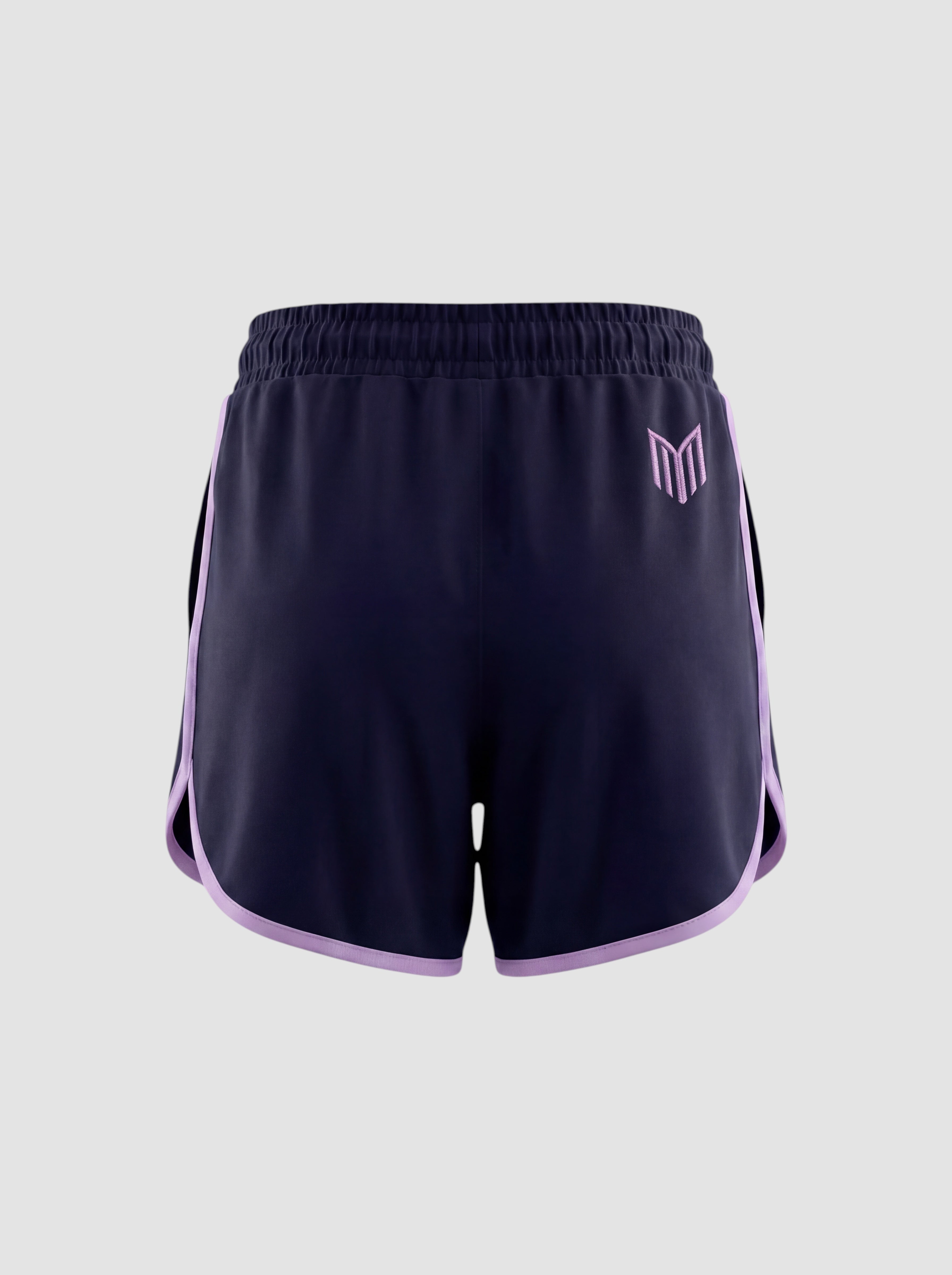 Maiden Cricket women's navy blue athletic shorts with light purple trim and logo, featuring a curved hem design.