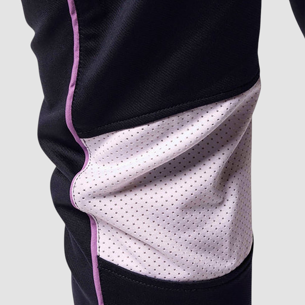 Maiden Cricket Nightwatch trousers featuring a black fabric leg with a light purple mesh knee vent and piping detail.