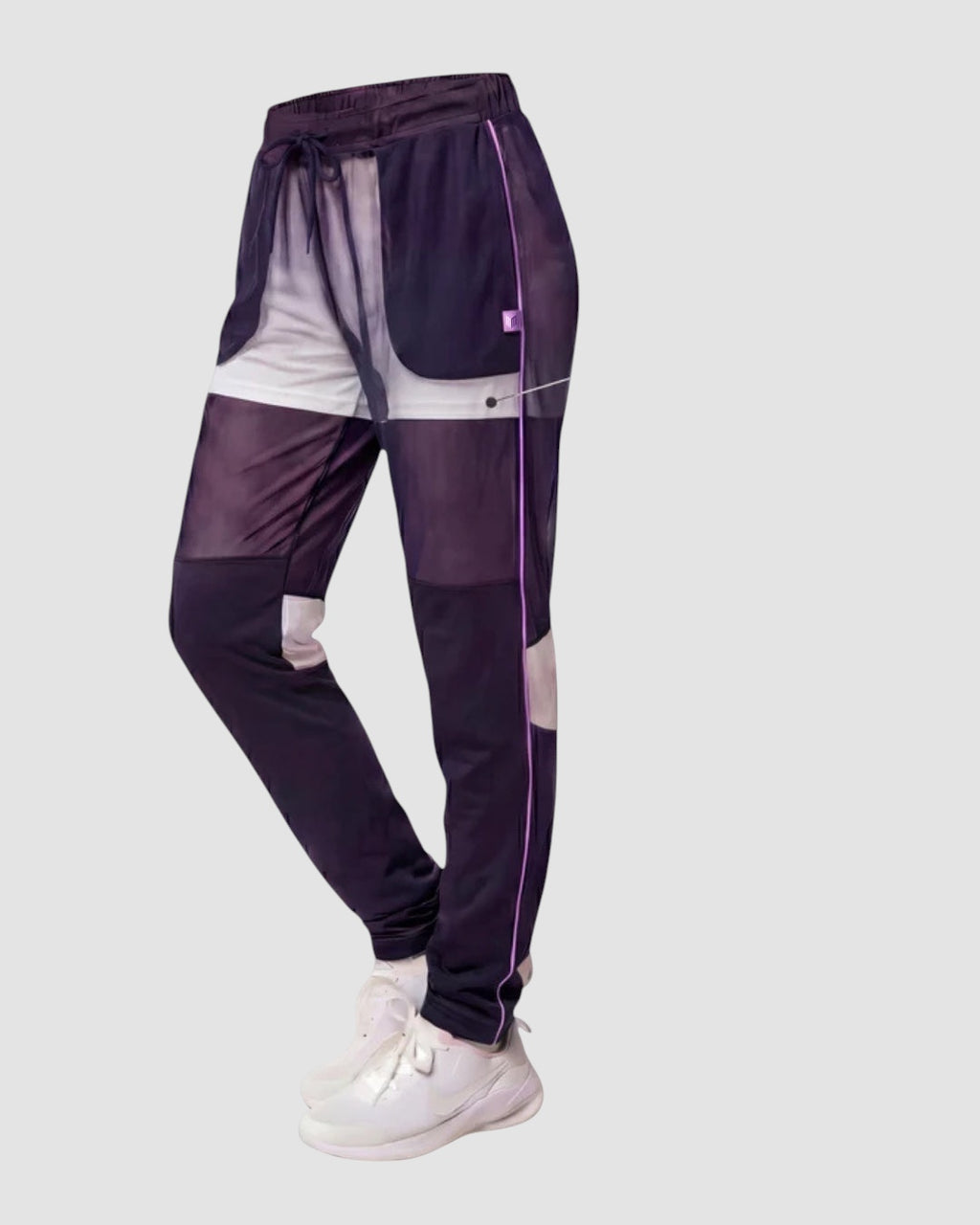 Maiden Cricket Nightwatch women's training trousers in dark navy with white accents, mesh knee vents, and side pockets.