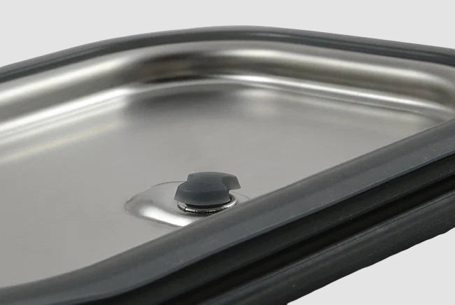 Maiden Cricket stainless steel lunch box lid with a leakproof silicone seal and vacuum valve for secure food storage.