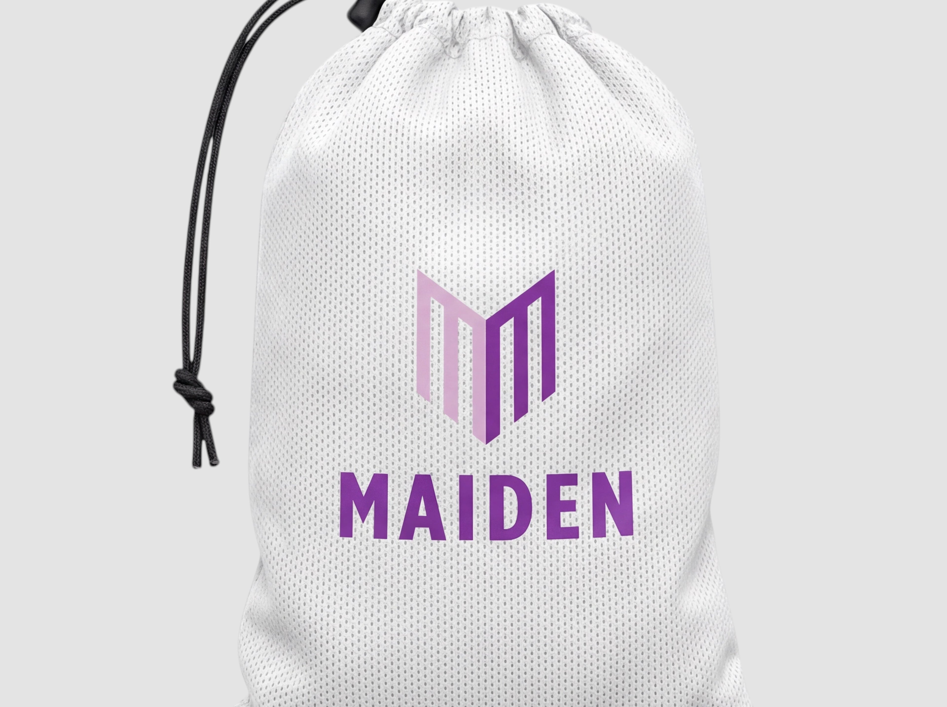 Maiden Cricket white mesh drawstring bag with purple logo branding for storing sports equipment.