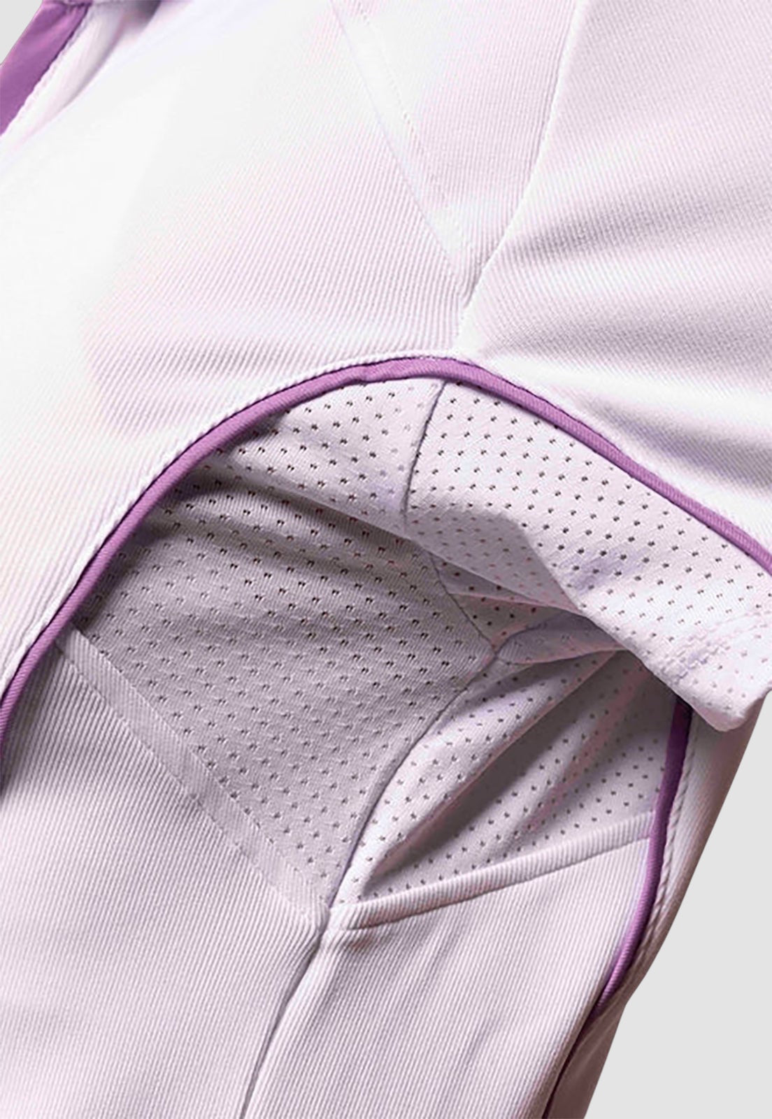 Maiden Cricket white performance top with purple trim and breathable mesh underarm panels for athletic movement