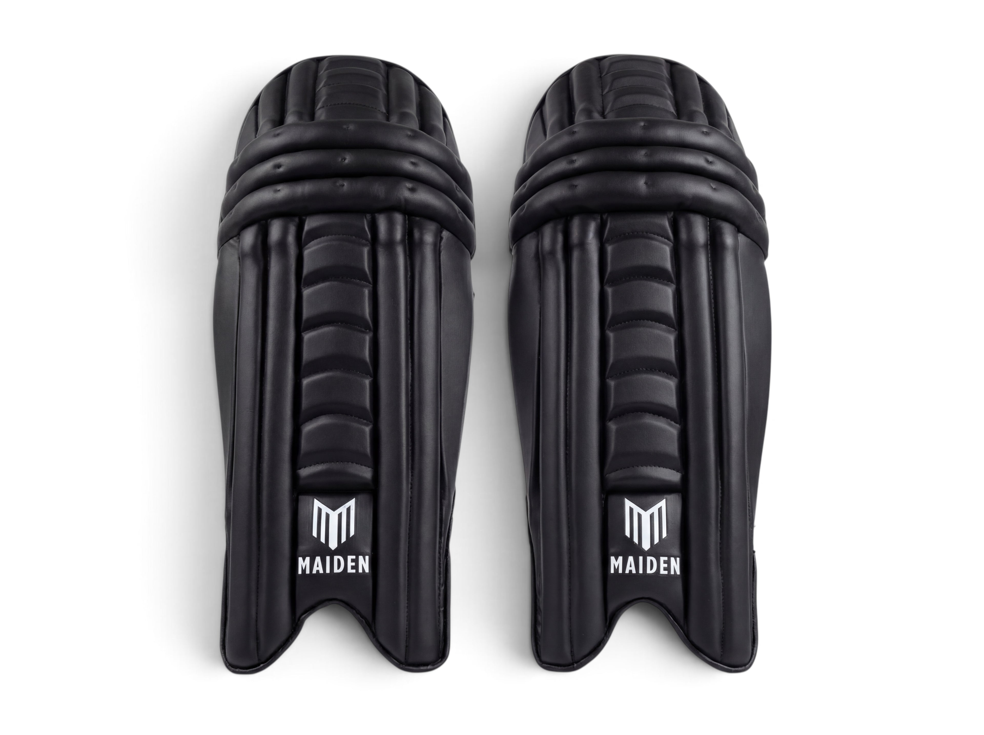 Maiden Cricket women's black batting pads with ergonomic knee design and lightweight impact protection.