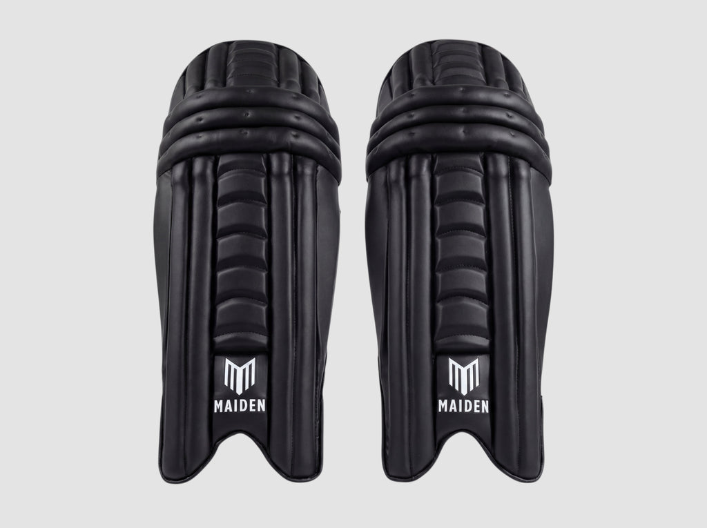 Maiden Cricket women's black batting pads with ergonomic knee design and lightweight high-impact front armour