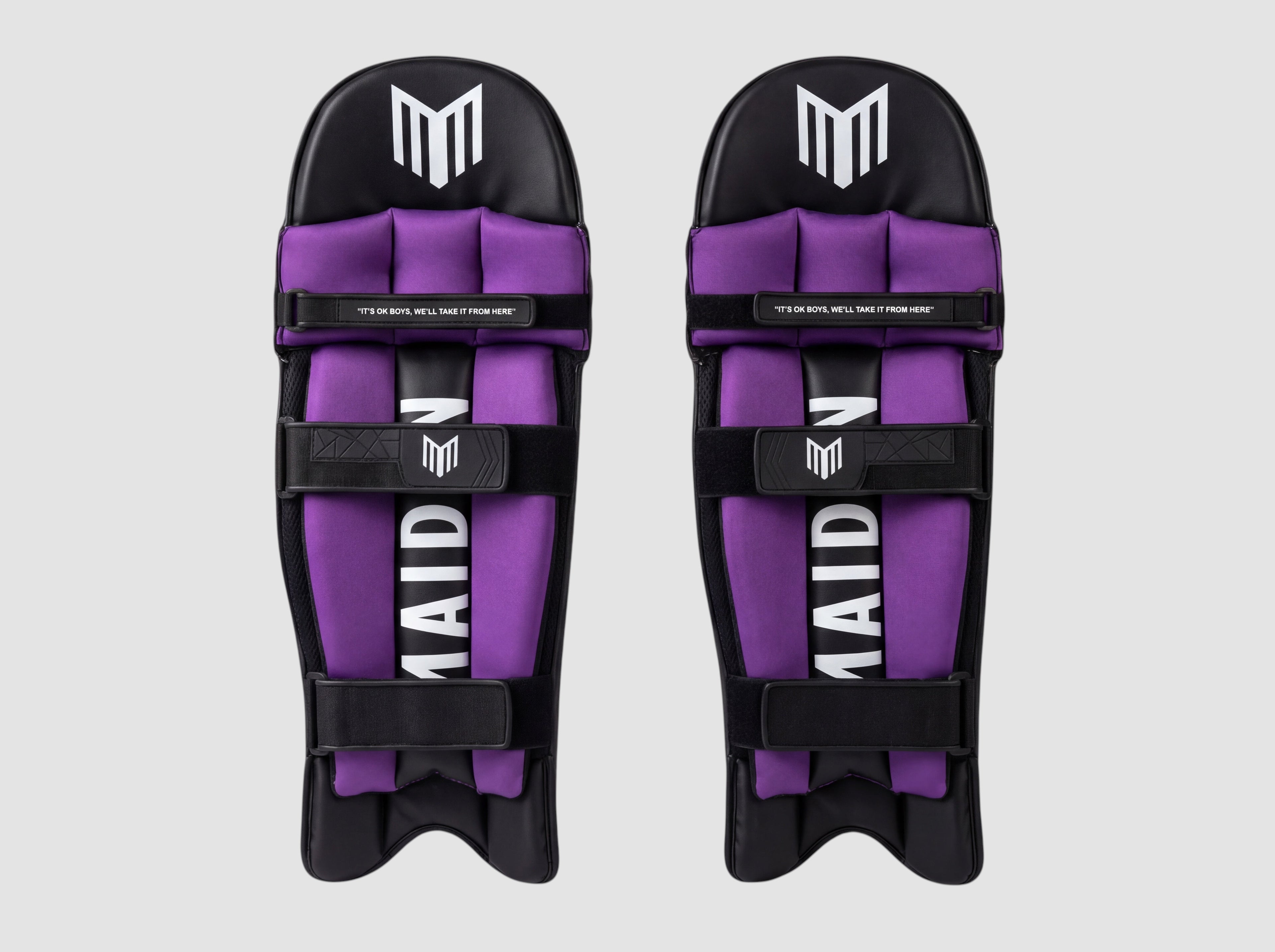 Maiden Cricket women's black and purple batting pads with ergonomic knee design and secure straps for a custom fit.
