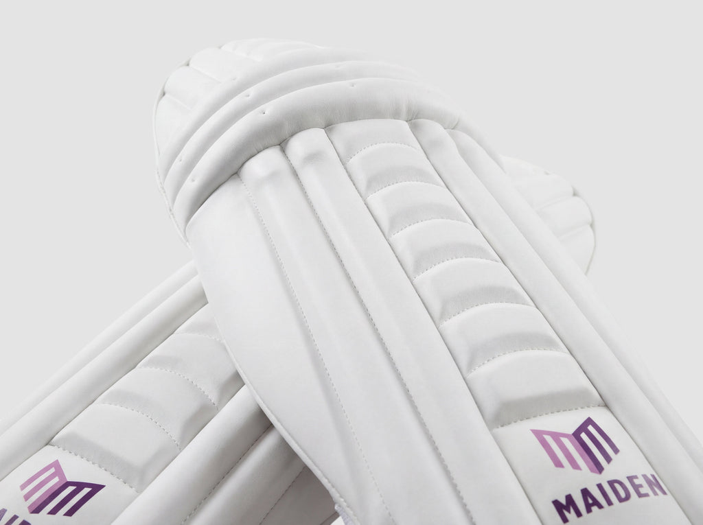 Maiden Cricket white women's batting pads with ergonomic knee curve and lightweight high-impact protective armour