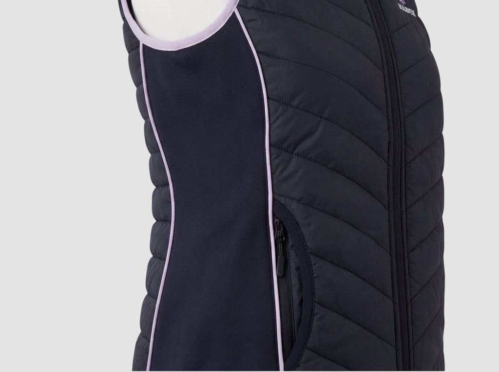 Maiden Cricket Yorker Gilet in black with lavender trim, featuring stretch side panels and a zippered side pocket.