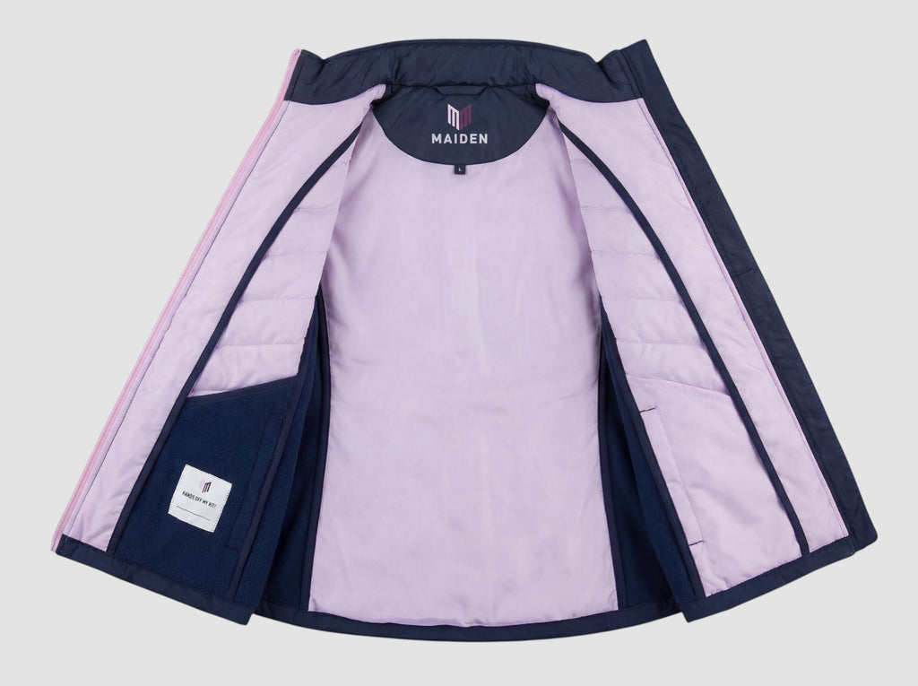 Maiden Cricket Yorker Gilet for women in navy with a light purple interior lining and stretch side panels.
