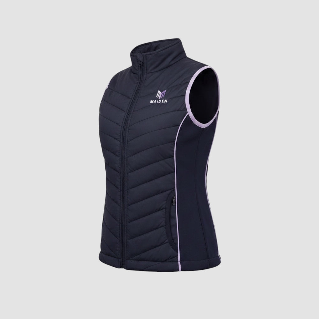 Maiden Cricket Yorker women's black insulated gilet with lilac trim and stretch side panels for athletic movement.